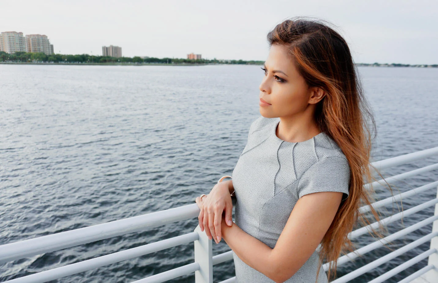 Grace Belen standing at a waterfront railing